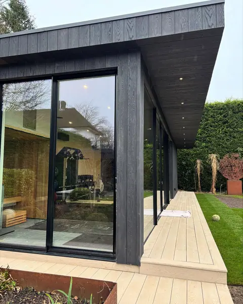 Here is the “garden room” a sauna, gym and golf simulator. All timber frame fini